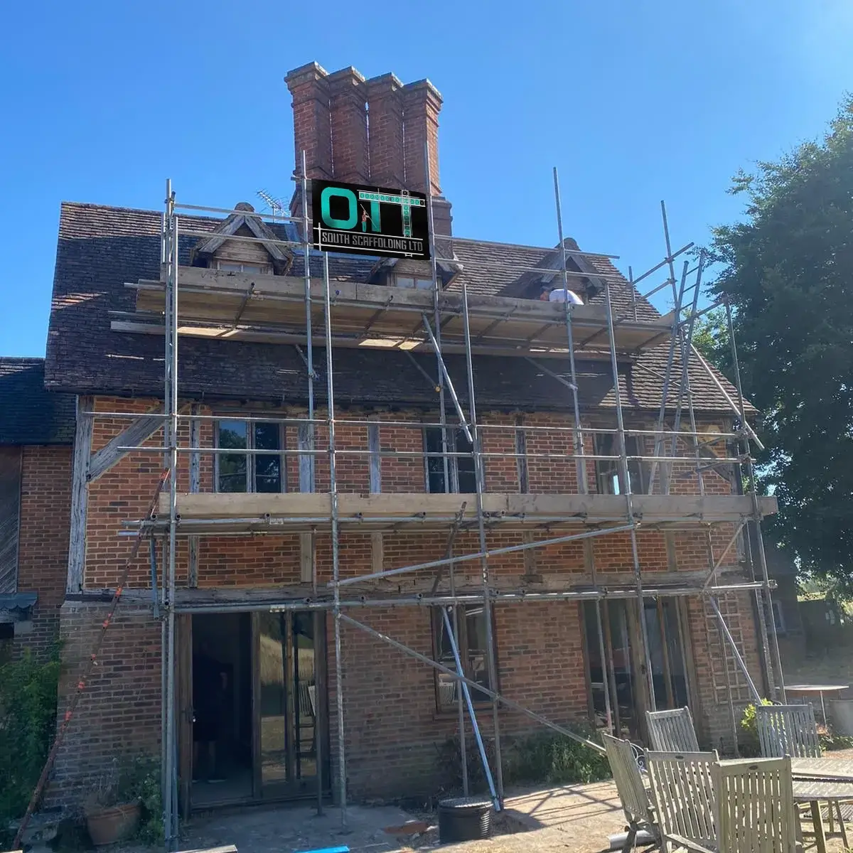 a house under construction with scaffolding around it