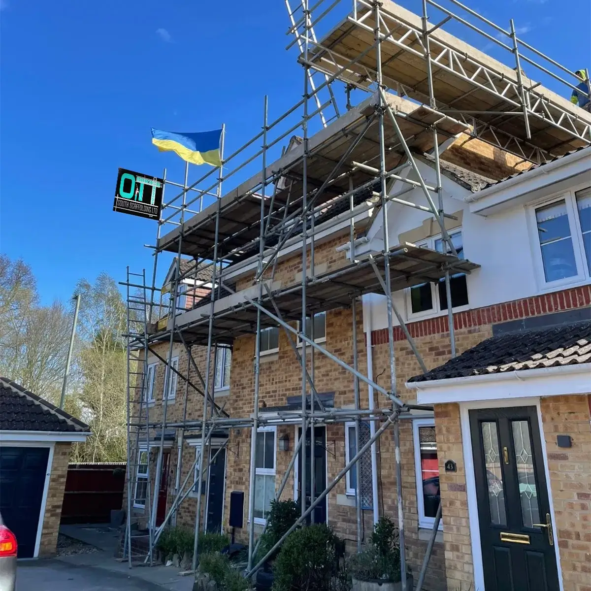 a house under construction with scaffolding around it