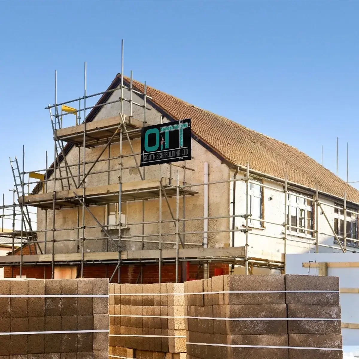 a house under construction with scaffolding around it